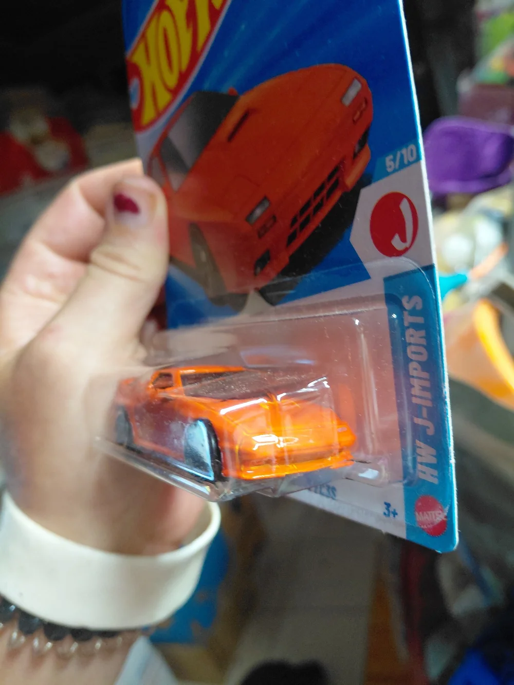 the Hot Wheels '89 Mazda Savanna RX-7 FC3S in orange, part of the 2026 HW J-Impo